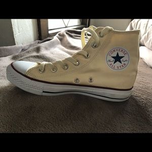 Cream/yellow hightop converse
